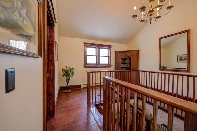 25 Winds Way Dr, Nobleboro, ME 04555 - corridor with a baseboard radiator, an upstairs landing, vaulted ceiling, hardwood / wood-style floors, and a chandelier