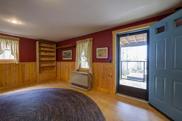 25 Winds Way Dr, Nobleboro, ME 04555 - entryway featuring wainscoting, light wood-style flooring, heating unit, and wood walls