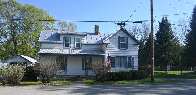 40 Baker St, Bingham, ME 04920 - view of front of home featuring a porch, a standing seam roof, a chimney, and metal roof