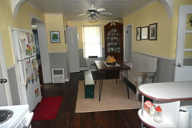 40 Baker St, Bingham, ME 04920 - dining room with a ceiling fan, arched walkways, wood finished floors, ornamental molding, and wainscoting