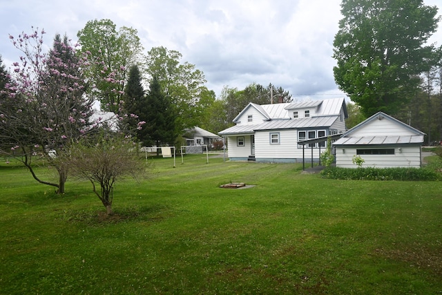 40 Baker St, Bingham, ME 04920 - view of green lawn with an outdoor fire pit