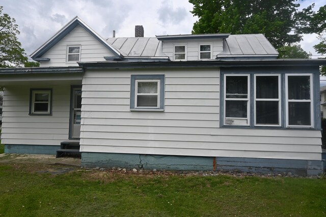 40 Baker St, Bingham, ME 04920 - view of home's exterior featuring a standing seam roof, a yard, and metal roof