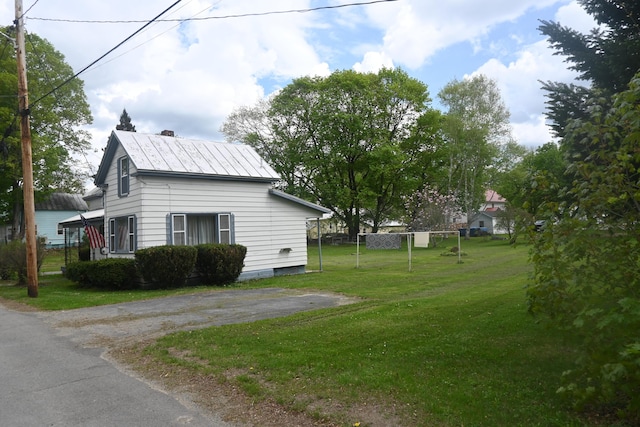 40 Baker St, Bingham, ME 04920 - view of side of property featuring a lawn