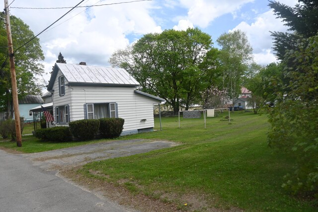 40 Baker St, Bingham, ME 04920 - view of side of property featuring a lawn