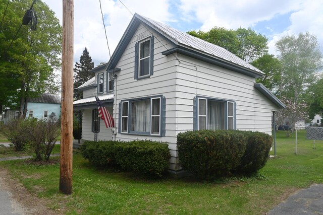 40 Baker St, Bingham, ME 04920 - view of side of home with a lawn