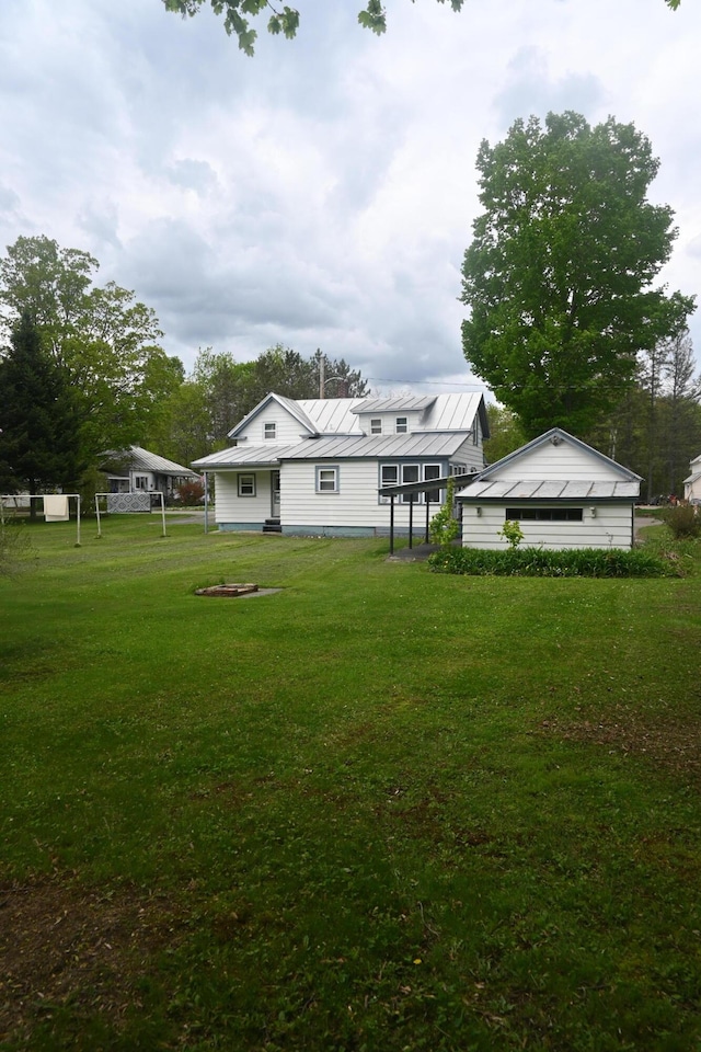 40 Baker St, Bingham, ME 04920 - back of property featuring a yard, metal roof, and a standing seam roof