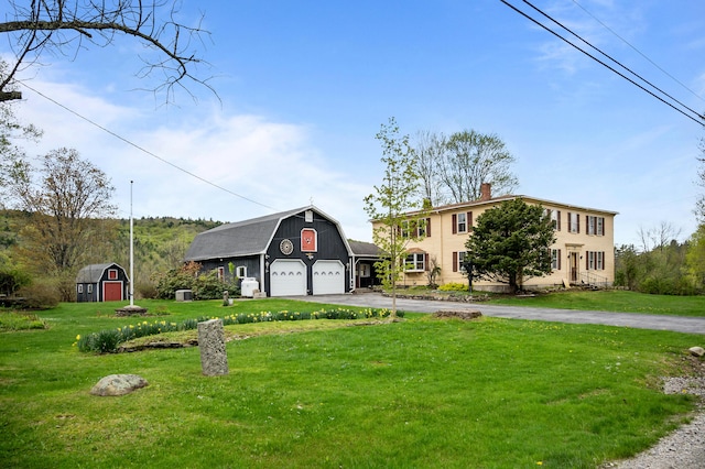 691 N Rd, Parsonsfield, ME 04047 - view of front of home featuring an outdoor structure, a barn, driveway, and a front lawn