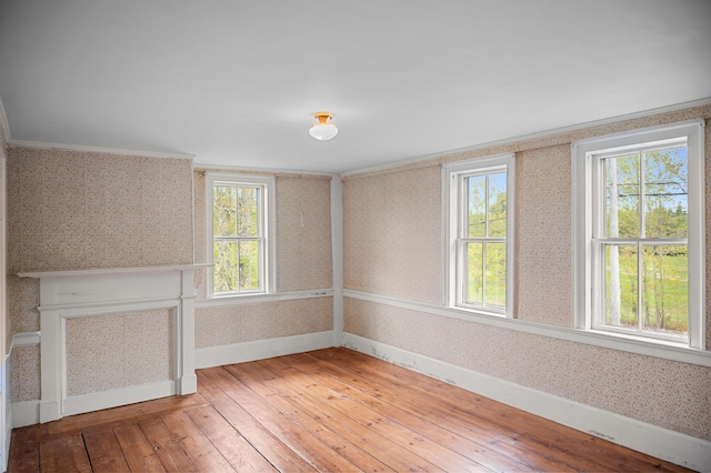 691 N Rd, Parsonsfield, ME 04047 - empty room with wallpapered walls, baseboards, light wood-style floors, and crown molding