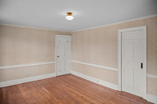691 N Rd, Parsonsfield, ME 04047 - unfurnished room with wallpapered walls, hardwood / wood-style flooring, baseboards, and ornamental molding