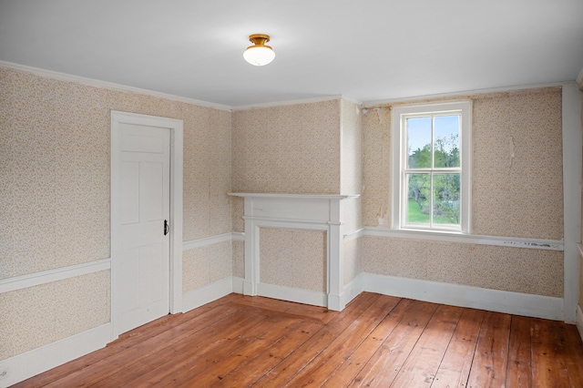 691 N Rd, Parsonsfield, ME 04047 - unfurnished room with wallpapered walls, wood-type flooring, baseboards, and ornamental molding