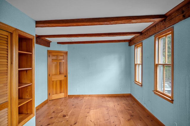 691 N Rd, Parsonsfield, ME 04047 - spare room with beamed ceiling, light wood finished floors, and baseboards