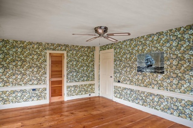 691 N Rd, Parsonsfield, ME 04047 - empty room with wallpapered walls, a ceiling fan, wood finished floors, and baseboards