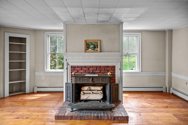 691 N Rd, Parsonsfield, ME 04047 - living area with a baseboard heating unit, wood-type flooring, and crown molding