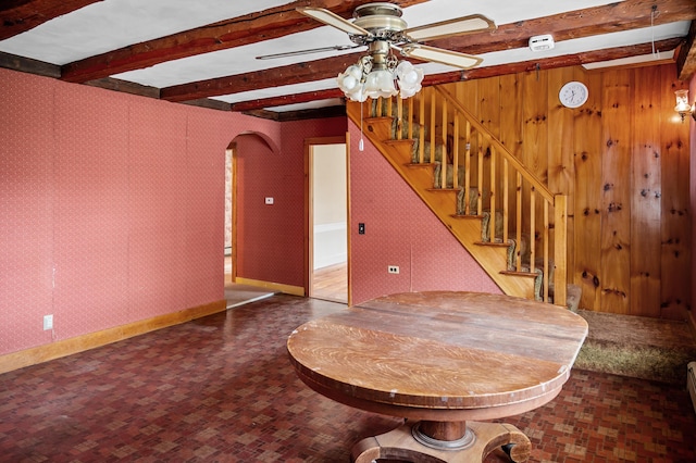 691 N Rd, Parsonsfield, ME 04047 - unfurnished living room with ceiling fan, arched walkways, beamed ceiling, stairway, and baseboards
