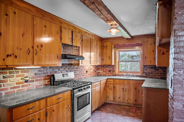691 N Rd, Parsonsfield, ME 04047 - kitchen featuring stainless steel range with gas stovetop, a sink, under cabinet range hood, backsplash, and brown cabinetry