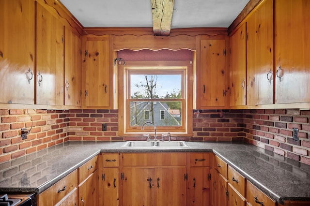 691 N Rd, Parsonsfield, ME 04047 - kitchen featuring a sink, brown cabinetry, beam ceiling, and dark countertops