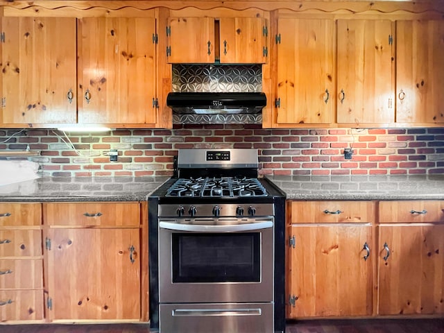 691 N Rd, Parsonsfield, ME 04047 - kitchen featuring stainless steel gas range oven, under cabinet range hood, backsplash, and brown cabinets