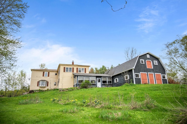 691 N Rd, Parsonsfield, ME 04047 - rear view of property featuring a barn, a chimney, an outbuilding, and a detached garage