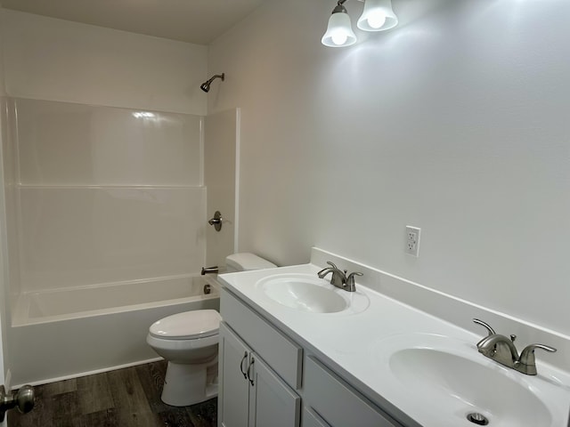 full bath featuring toilet, wood finished floors, shower / tub combination, and double vanity