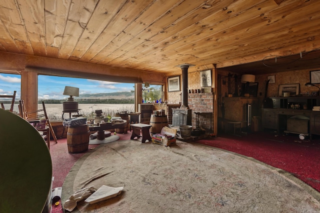 12 York Ln, Dallas Plt, ME 04970 - carpeted living room with a wood stove and wood ceiling