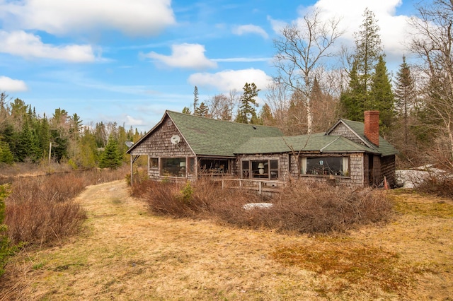 12 York Ln, Dallas Plt, ME 04970 - back of property with roof with shingles and a chimney