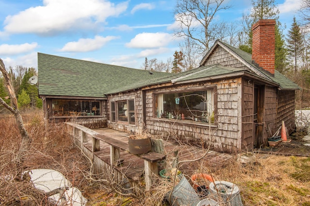 12 York Ln, Dallas Plt, ME 04970 - back of property featuring a chimney and roof with shingles