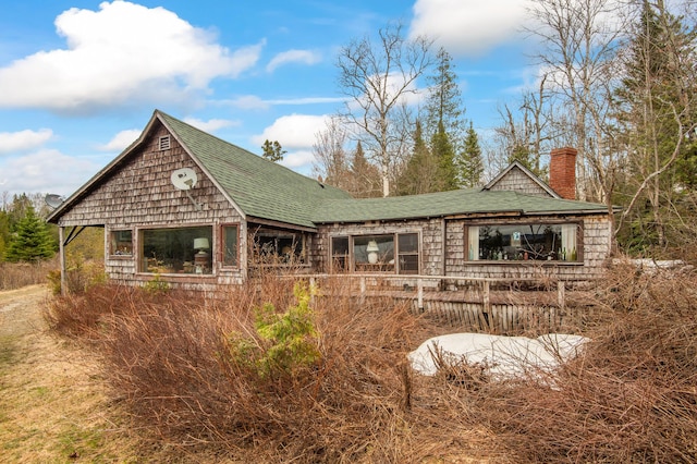 12 York Ln, Dallas Plt, ME 04970 - rear view of property with a chimney and roof with shingles