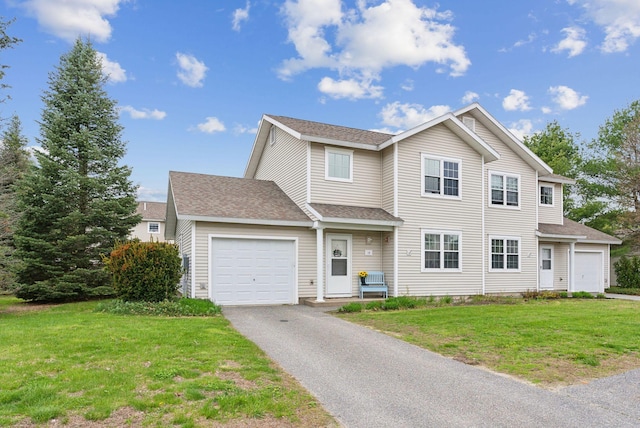 10 Hornet St Unit 10, Brunswick, ME 04011 - view of front of home with a garage, asphalt driveway, a front yard, and roof with shingles