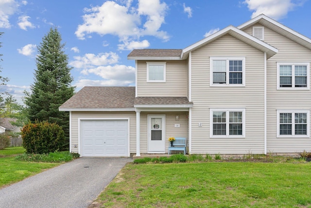 10 Hornet St Unit 10, Brunswick, ME 04011 - view of front facade featuring an attached garage, a front yard, asphalt driveway, and a shingled roof