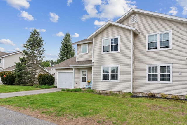 10 Hornet St Unit 10, Brunswick, ME 04011 - view of front of house featuring asphalt driveway, a front lawn, a garage, and a shingled roof