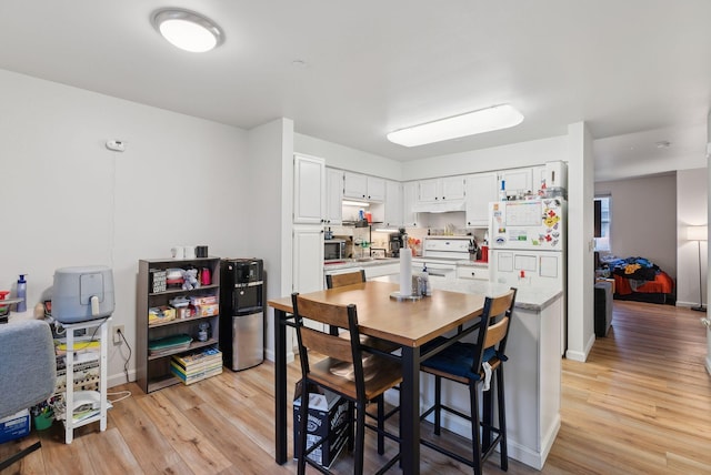 10 Hornet St Unit 10, Brunswick, ME 04011 - dining space with light wood-style floors and baseboards