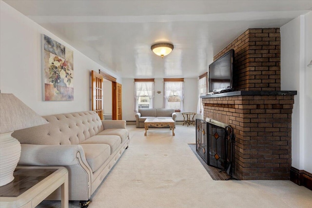 living room featuring carpet floors and a brick fireplace