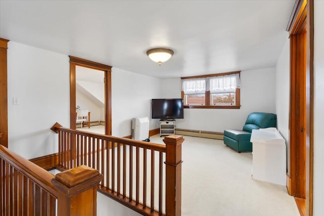 living area with a baseboard radiator and carpet