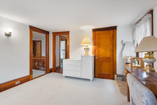 sitting room with light colored carpet and baseboards
