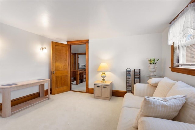 living room with light colored carpet and baseboards