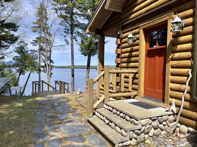 869 Turkey Tail Rd Unit T4, Indian Purchase Twp, ME 04462 - property entrance featuring log veneer siding and a water view