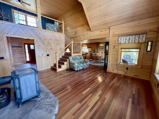 869 Turkey Tail Rd Unit T4, Indian Purchase Twp, ME 04462 - living room featuring wood walls, stairway, wooden ceiling, wood-type flooring, and plenty of natural light