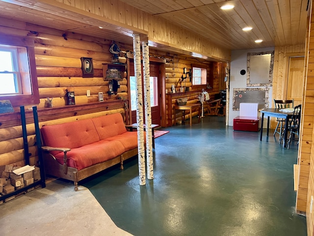 869 Turkey Tail Rd Unit T4, Indian Purchase Twp, ME 04462 - sitting room featuring concrete floors, rustic walls, recessed lighting, and wood ceiling