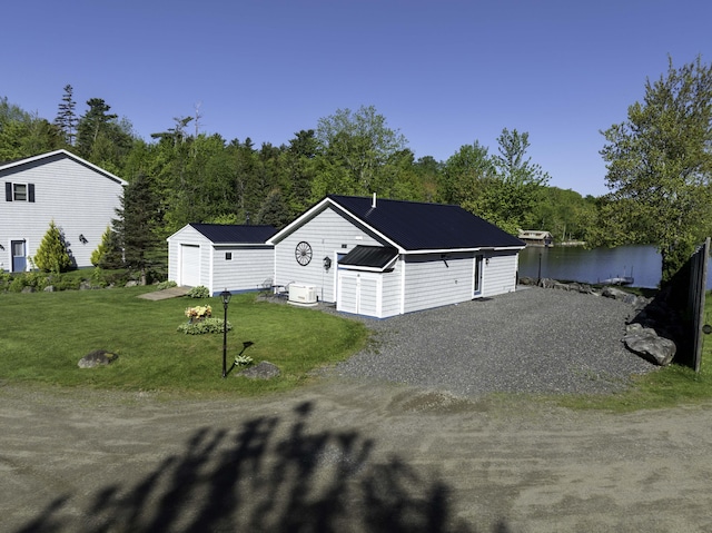 1824 Sunny Cove Ln, Meddybemps, ME 04657 - ranch-style home featuring a front yard, metal roof, and driveway