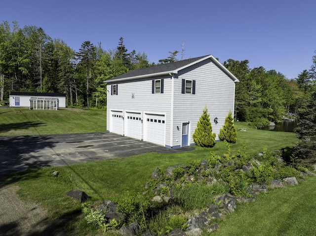 1824 Sunny Cove Ln, Meddybemps, ME 04657 - view of property exterior with driveway and a yard