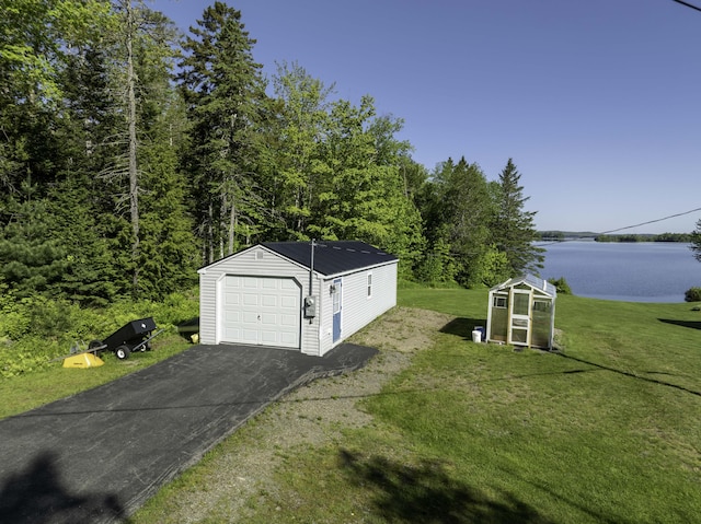 1824 Sunny Cove Ln, Meddybemps, ME 04657 - detached garage featuring a water view and driveway