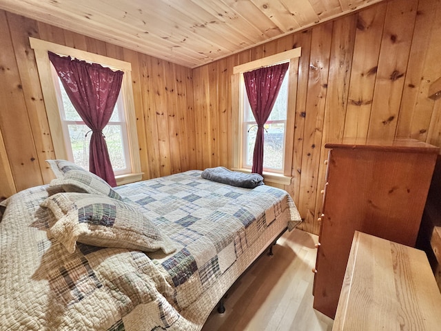 53 Pigeon Rd, Fletchers Landing Twp, ME 04605 - bedroom featuring hardwood / wood-style flooring, wood ceiling, and wood walls