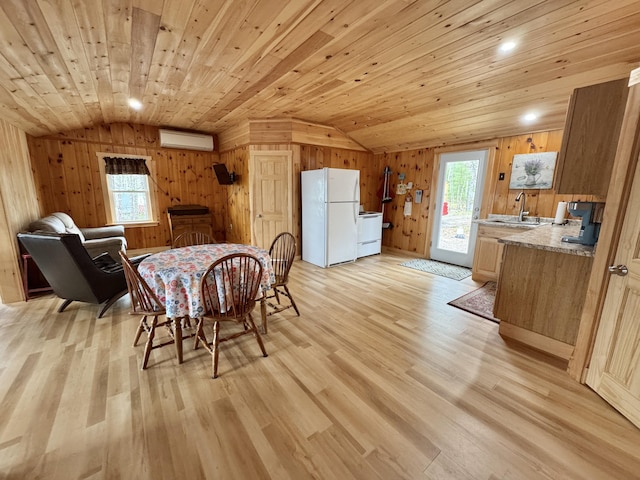 53 Pigeon Rd, Fletchers Landing Twp, ME 04605 - dining space featuring vaulted ceiling, plenty of natural light, light wood-style flooring, wood walls, and wood ceiling