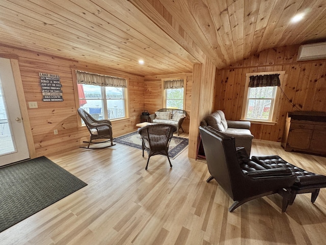 53 Pigeon Rd, Fletchers Landing Twp, ME 04605 - sitting room featuring vaulted ceiling, plenty of natural light, wood walls, light wood-style flooring, and wooden ceiling