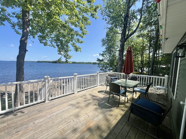 53 Pigeon Rd, Fletchers Landing Twp, ME 04605 - deck featuring a water view and outdoor dining space