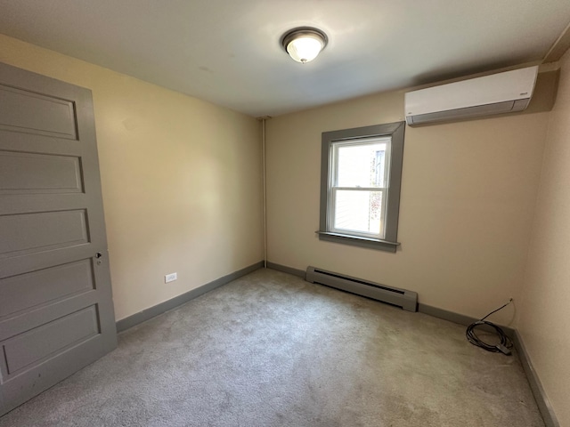 72 Seal Cove Rd, Southwest Harbor, ME 04679 - spare room with a wall unit AC, baseboard heating, carpet, and baseboards