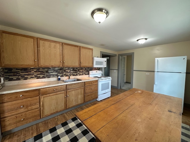 72 Seal Cove Rd, Southwest Harbor, ME 04679 - kitchen with white appliances, a sink, backsplash, and light countertops