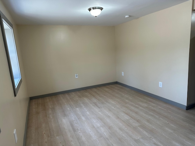 72 Seal Cove Rd, Southwest Harbor, ME 04679 - unfurnished room with light wood-style floors, baseboards, and a smoke detector