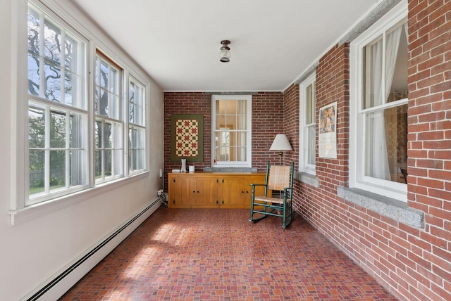 538 Malbons Mills Rd, Skowhegan, ME 04976 - sunroom featuring a baseboard radiator, brick wall, and healthy amount of natural light