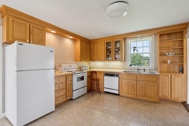 538 Malbons Mills Rd, Skowhegan, ME 04976 - kitchen featuring white appliances, a sink, light countertops, and glass insert cabinets